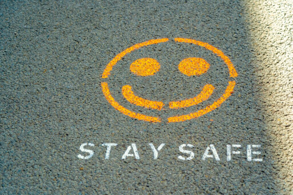 stay safe painted on pavement