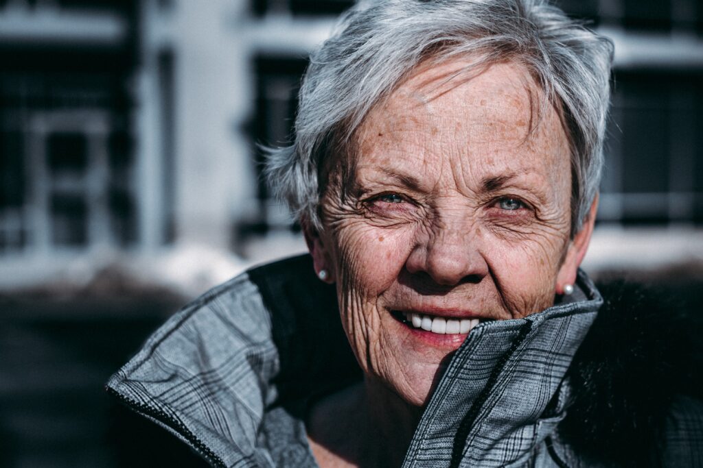 a women with grey hair smiling